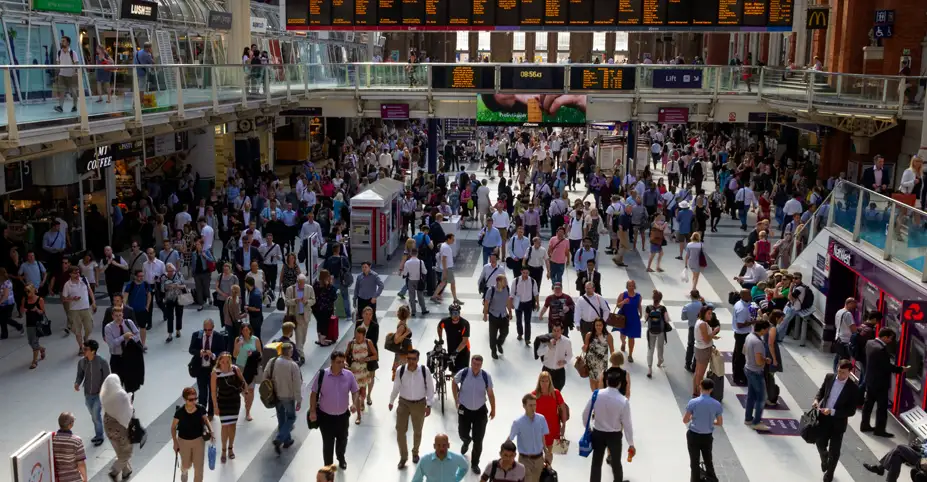 Crowded train station filled with people