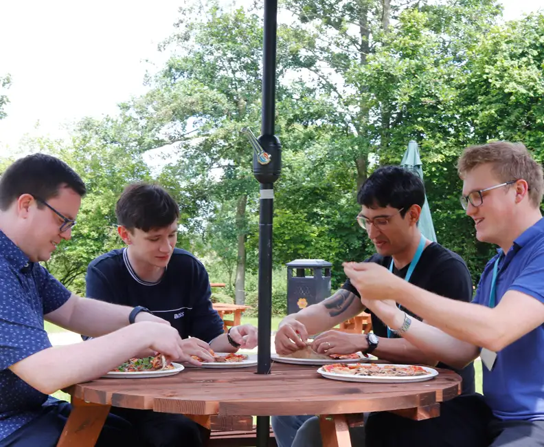 some of our engineers enjoying pizza at one of our weekly lunch events