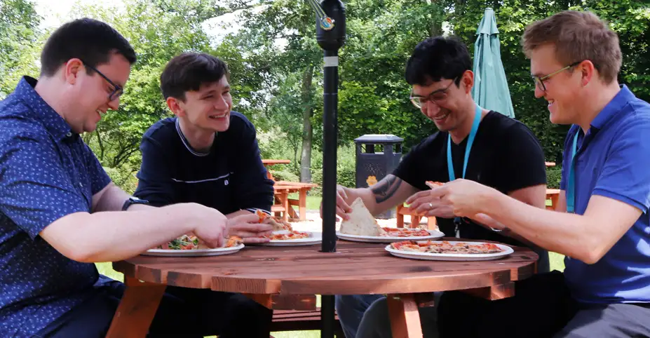 Some of our colleagues enjoying pizza at one of our weekly lunch events